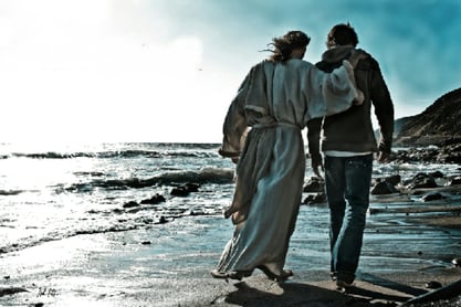 Jesus walking with young man