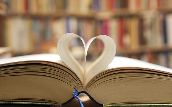 a book with pages folded to look like a heart